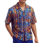 Navy men's short-sleeve shirt with a multi-colored abstract print and open camp collar