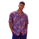 Blue men's short-sleeve shirt with a multi-colored abstract print and open camp collar.