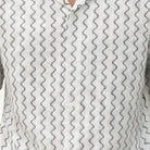 Close-up of white textured geometric knit fabric on Stacy Adams short sleeve shirt