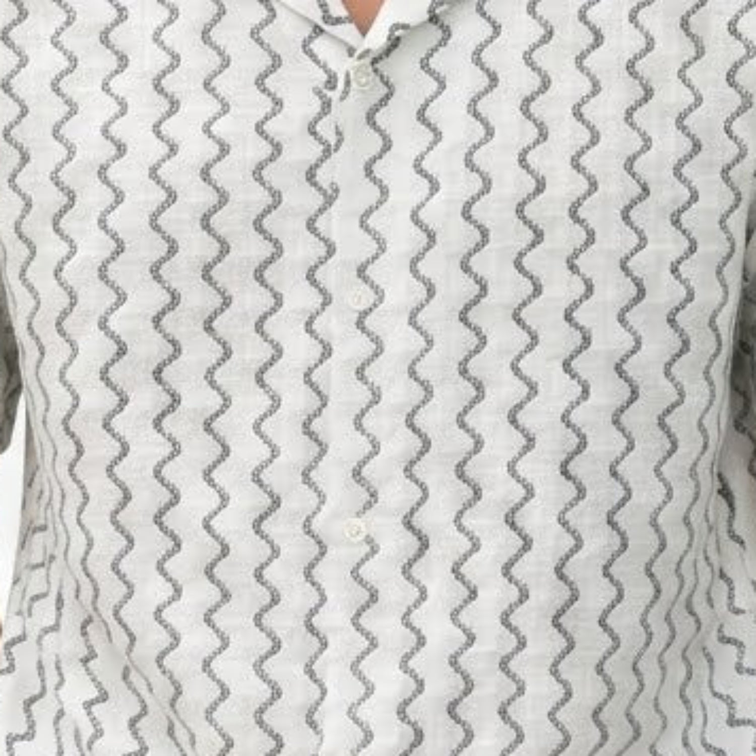 Close-up of white textured geometric knit fabric on Stacy Adams short sleeve shirt