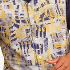 Close-up of purple abstract print short sleeve walking suit shirt by Stacy Adams