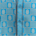 Close-up of Turquoise geometric tile and medallion shirt print