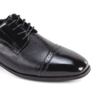 black leather dress shoes side view cap toe design