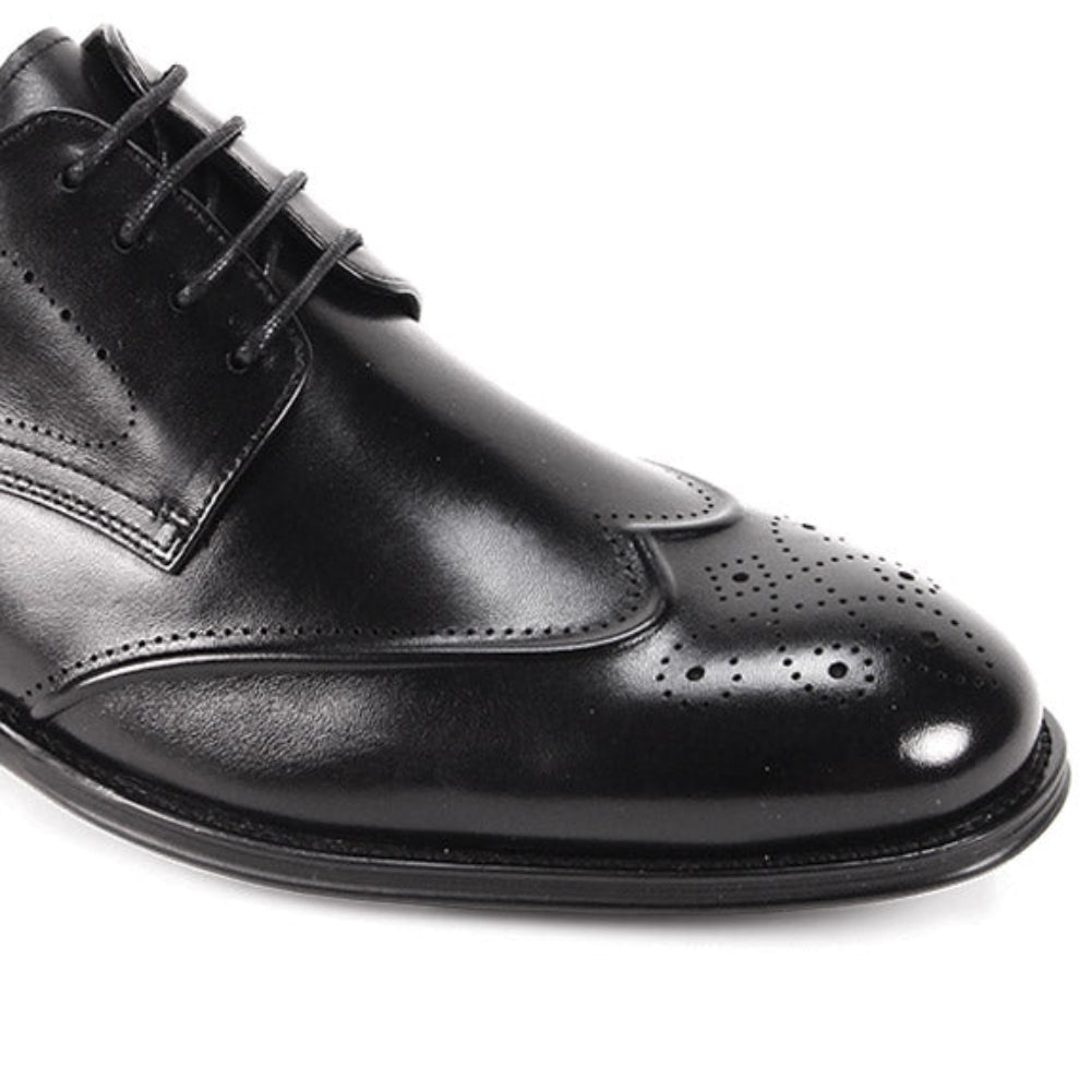 Black dress shoes with perforated wingtip detailing