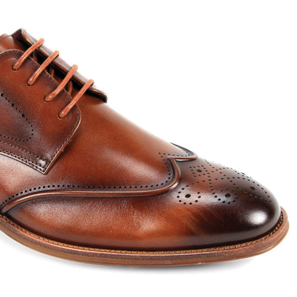 tan dress shoes with perforated wingtip detailing