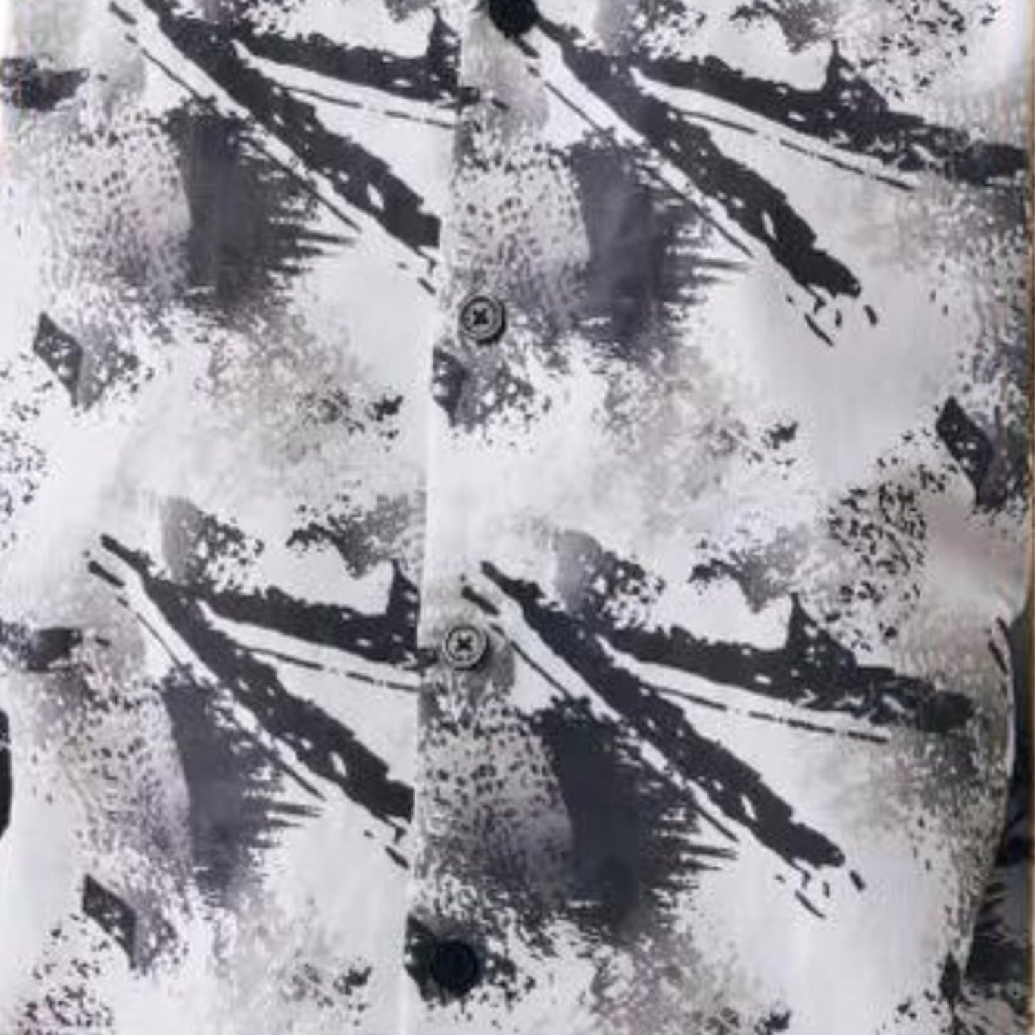 close up of black abstract splatter linen shirt pattern texture