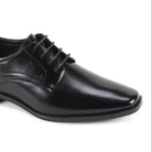 Close-up of men’s black plain-toe lace-up dress shoe