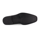 Bottom view of the outsole on men’s black slip-on dress loafer