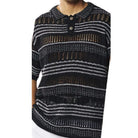 close up of black crochet knit shirt texture and stripe detailing