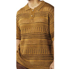 close up of tan crochet knit shirt texture and stripe detailing