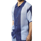 close up of navy and sky blue crochet knit shirt texture and button front