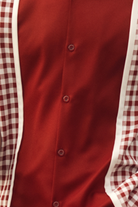 close up of burgundy checker plaid color block walking suit shirt