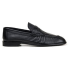 Side view of black Italian deerskin penny loafer