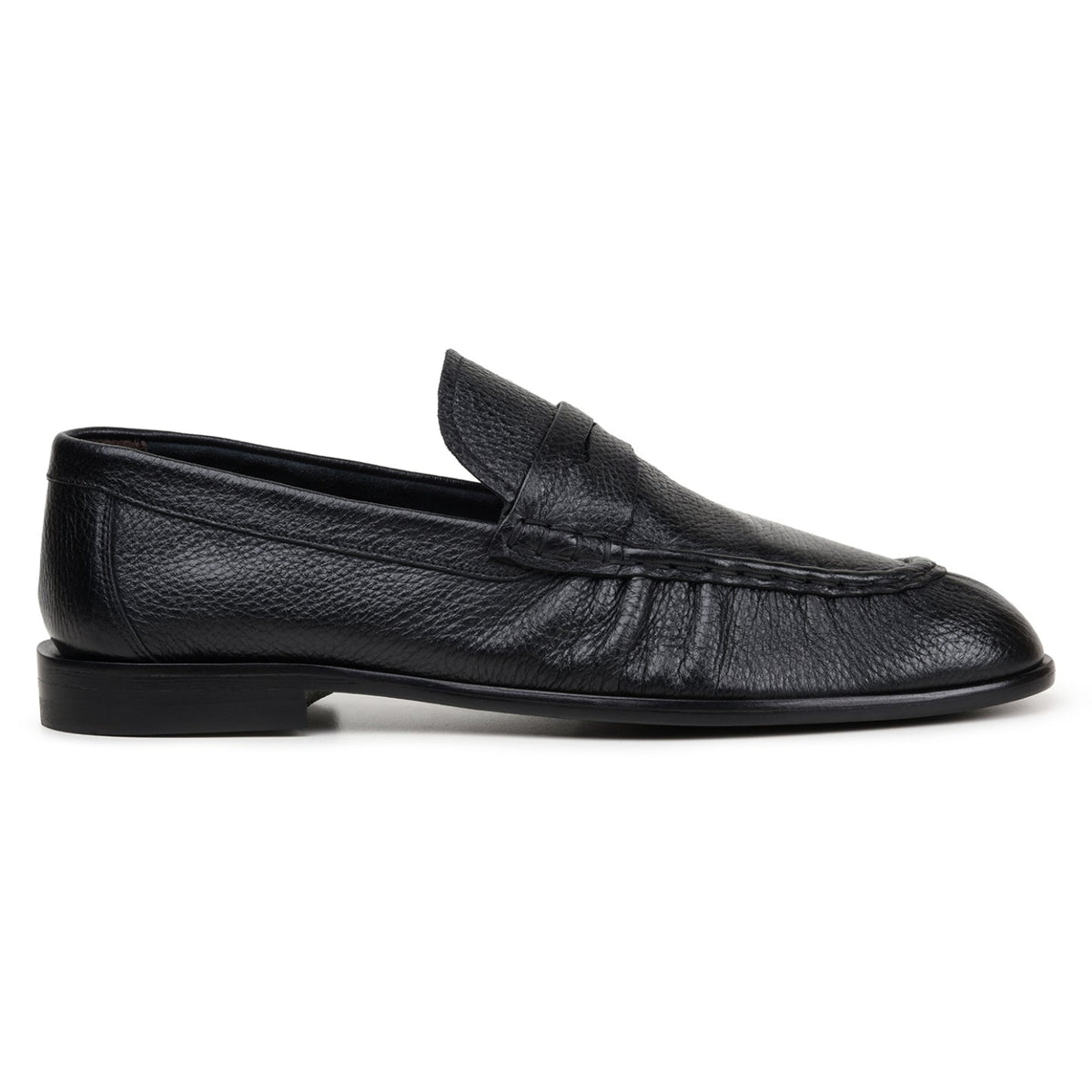 Side view of black Italian deerskin penny loafer