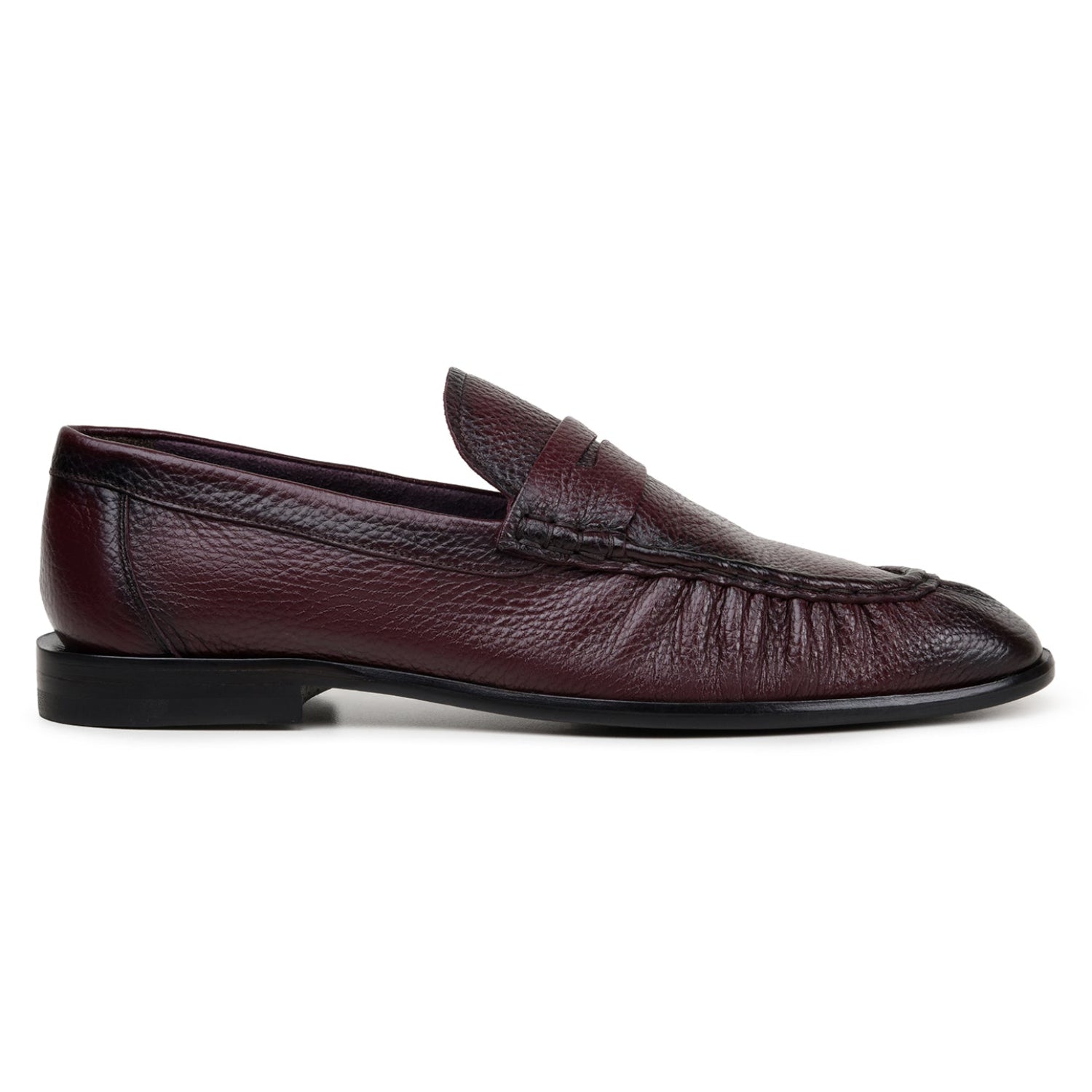Side view of burgundy Italian deerskin penny loafer