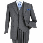 Three-quarter view of men’s grey three-piece double-breasted suit showing the peak lapels, vest and ticket pocket