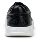 Back view of black low-top leather sneaker