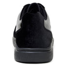 Rear view of black velvet Edmound sneaker with padded collar