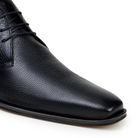 close-up black deerskin leather ankle boot texture and toe