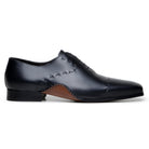 Side profile of black Maestro Oxford showing curved Opanka sole