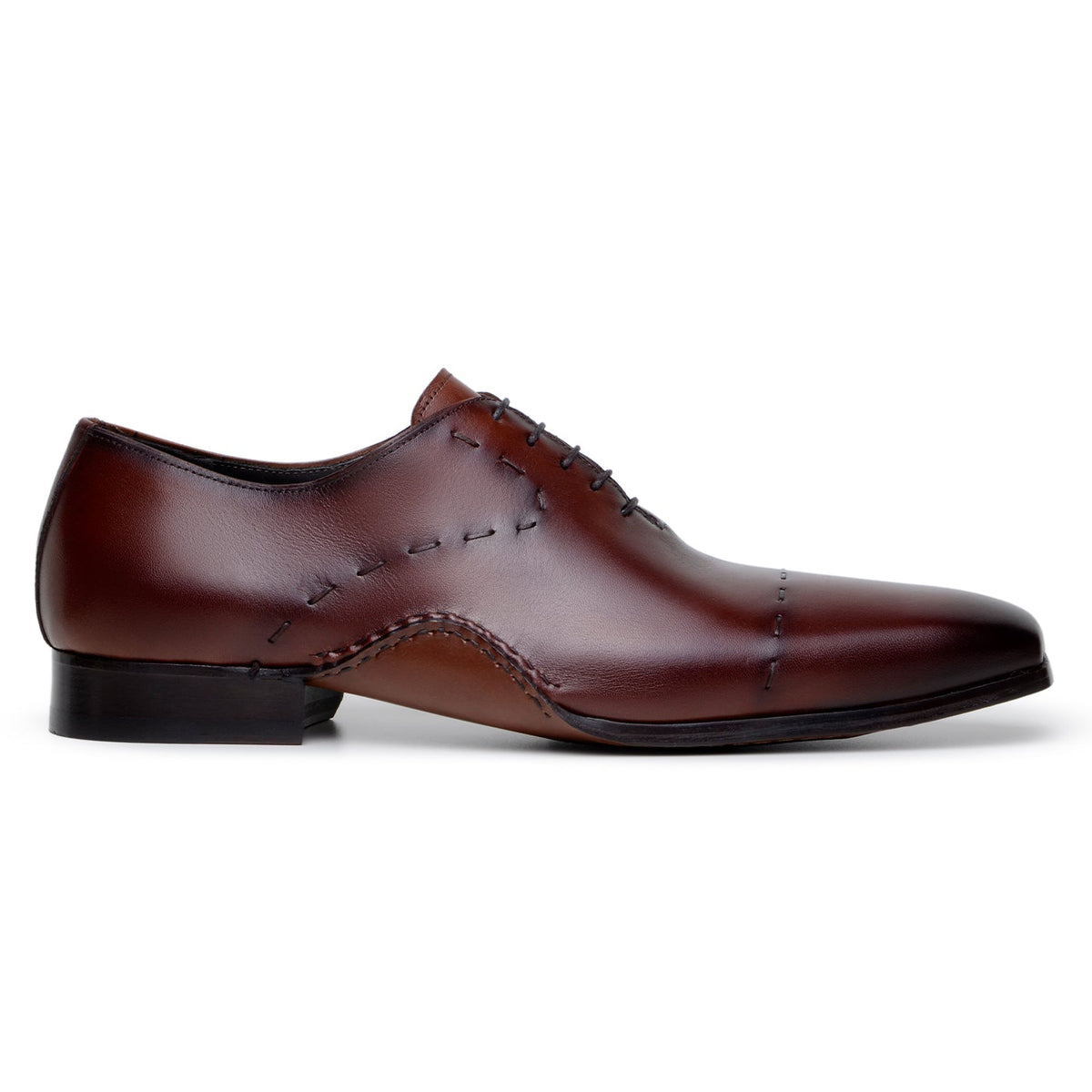 Side profile of antique cognac Maestro Oxford showing curved Opanka sole