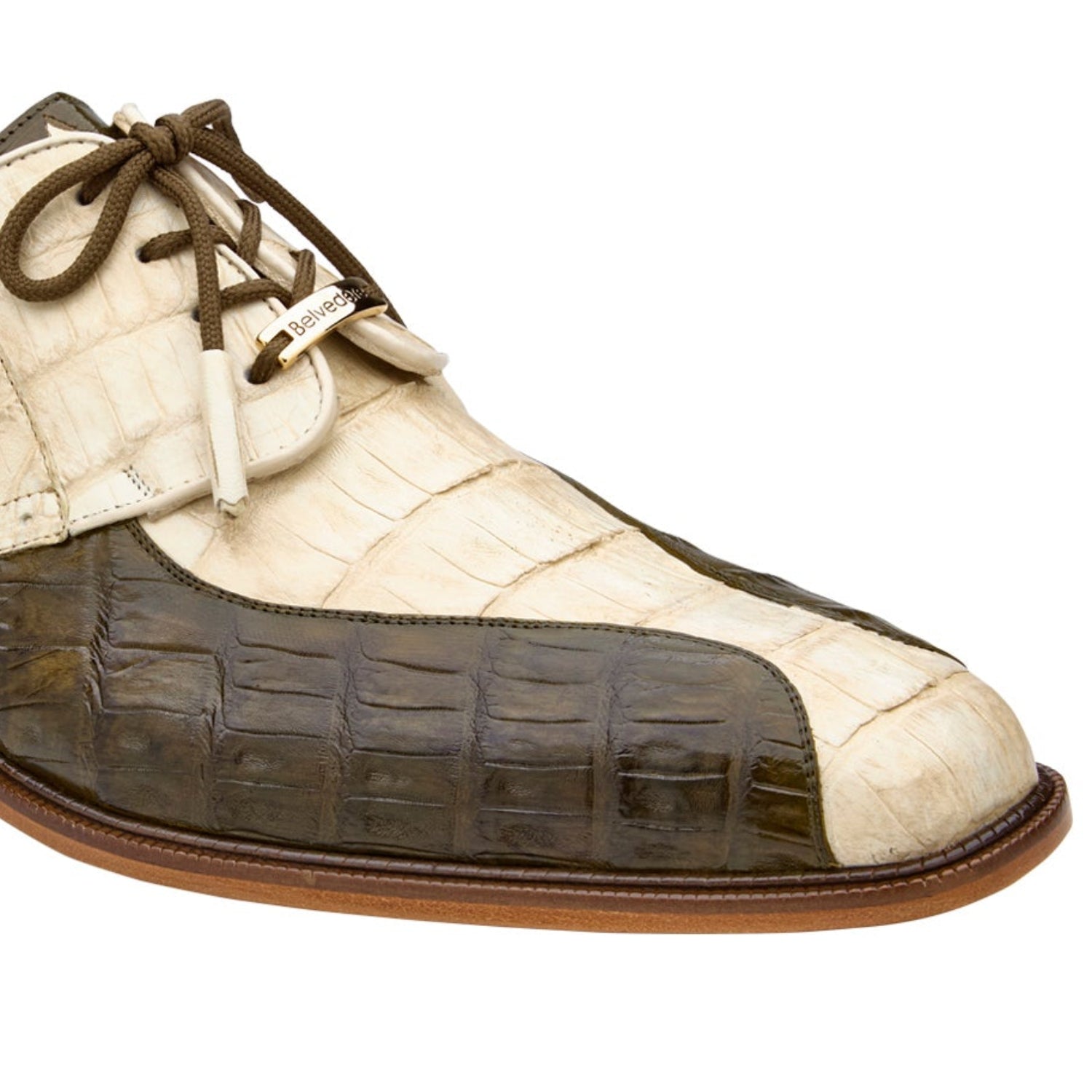 Close-up of genuine caiman leather texture and precision stitching on a olive Oxford shoe