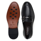 Leather and rubber outsole of black deerskin loafer