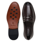 Leather and rubber outsole of brown deerskin loafer