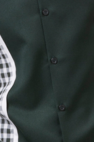 close up of emerald checker plaid color block walking suit shirt