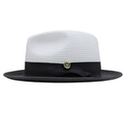 Black and white Montique fedora hat side view with white woven crown, black band, and matching black brim