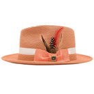 Montique peach straw fedora hat front view with white band, peach bow, feather trim, and gold logo pin