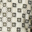 Close up of Stacy Adams oive and ivory crochet woven geometric fabric pattern