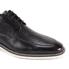 close-up perforated leather detail  black moc toe dress shoe
