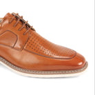 close-up perforated leather detail tan moc toe dress shoe