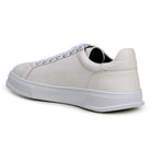 Angled view of white deerskin loafer with silver-tone bit