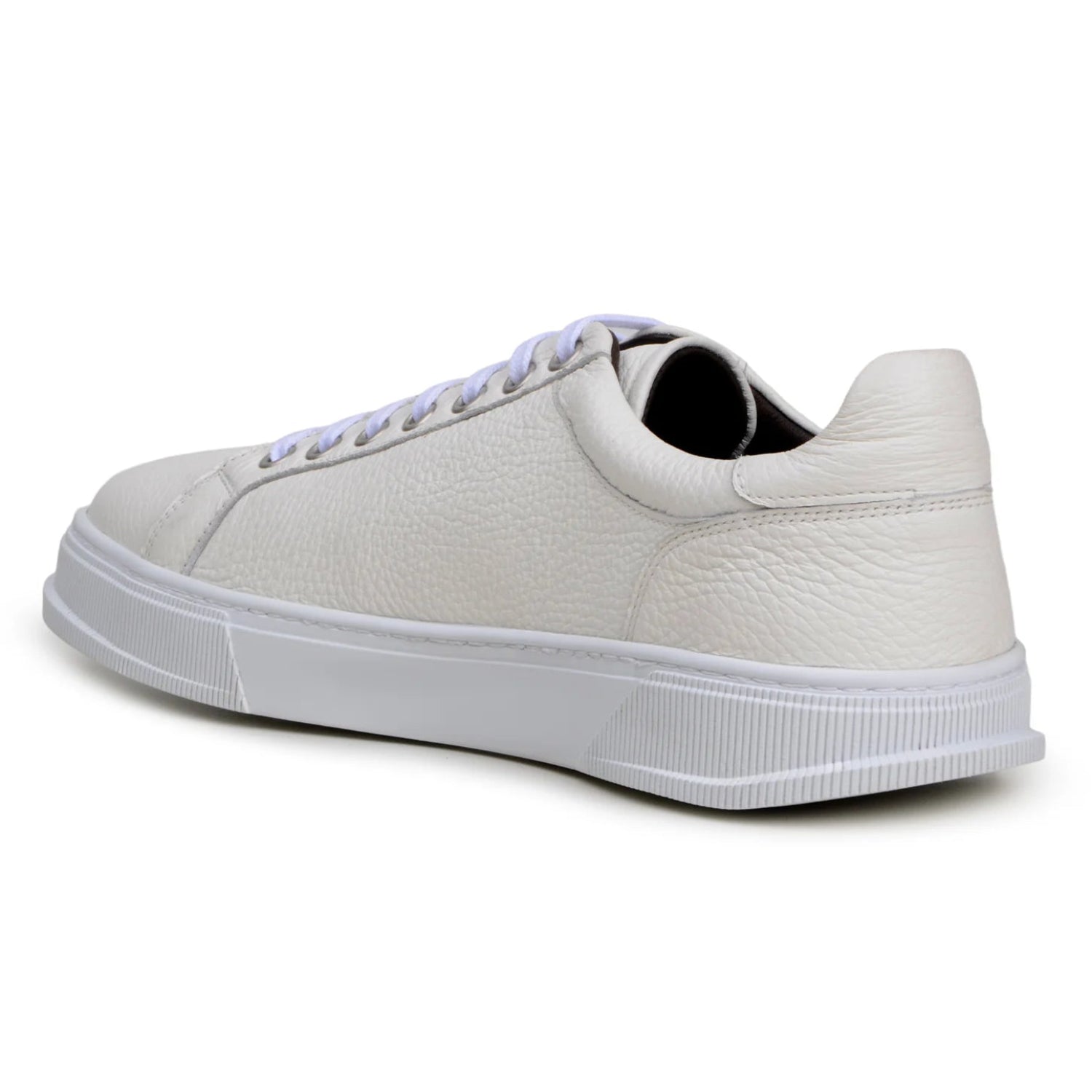 Angled view of white deerskin loafer with silver-tone bit