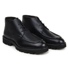 Pair of black hornback and calfskin chukka boots