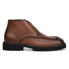 Side view of antique tan hornback leather chukka boot