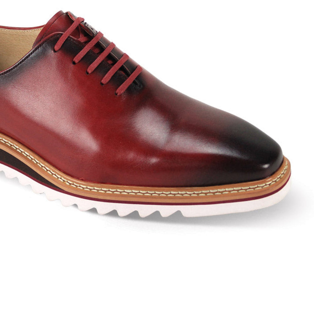 close up of wine plain toe lace-up leather dress shoes
