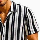 Close-up of black and white vertical stripe fabric on Stacy Adams short sleeve shirt