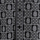 Close-up of black geometric tile and medallion shirt print
