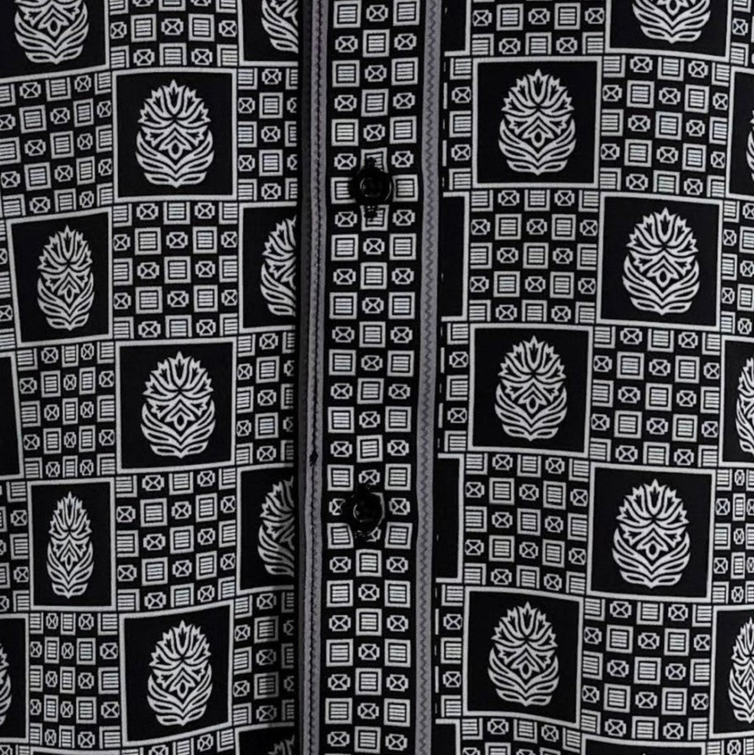 Close-up of black geometric tile and medallion shirt print