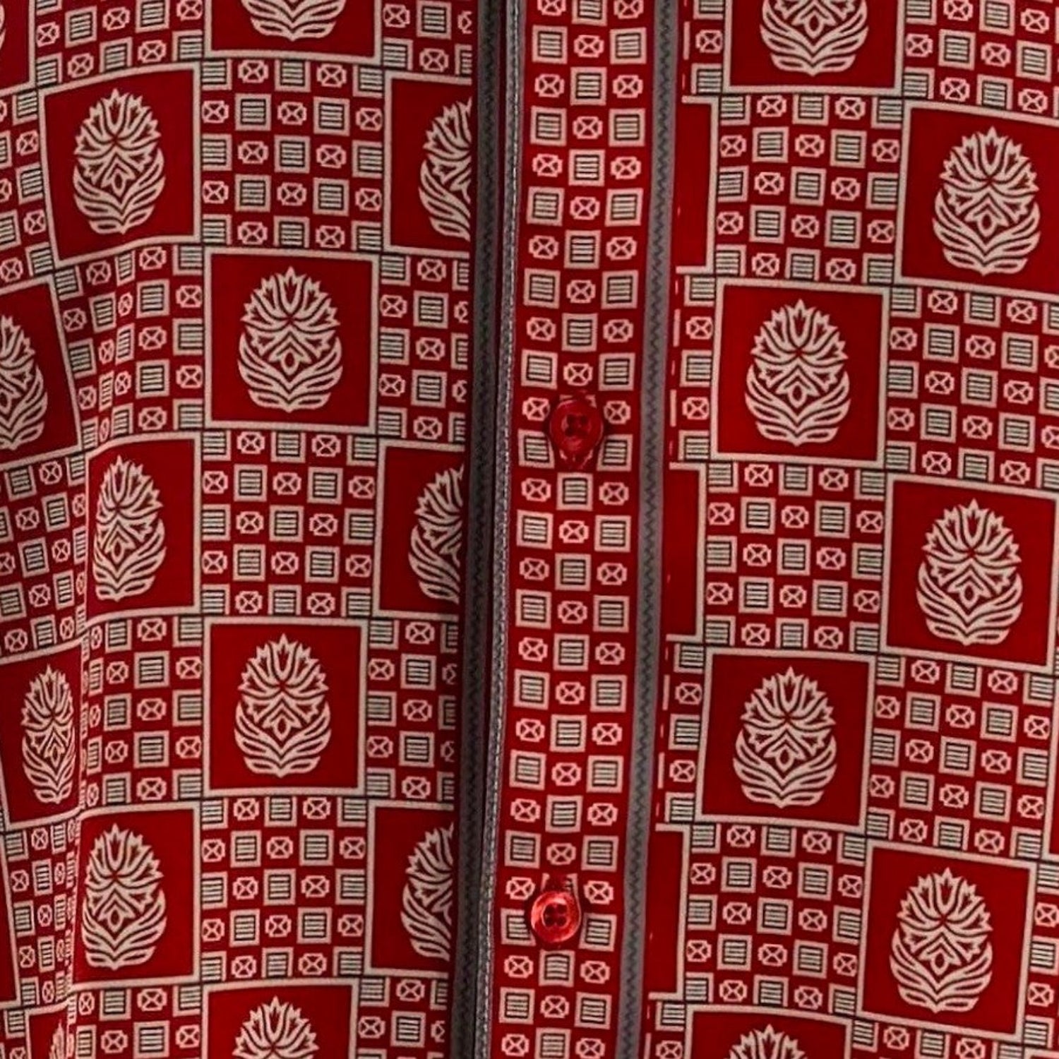 Close-up of navy geometric tile and medallion shirt print