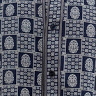 Close-up of navy geometric tile and medallion shirt print