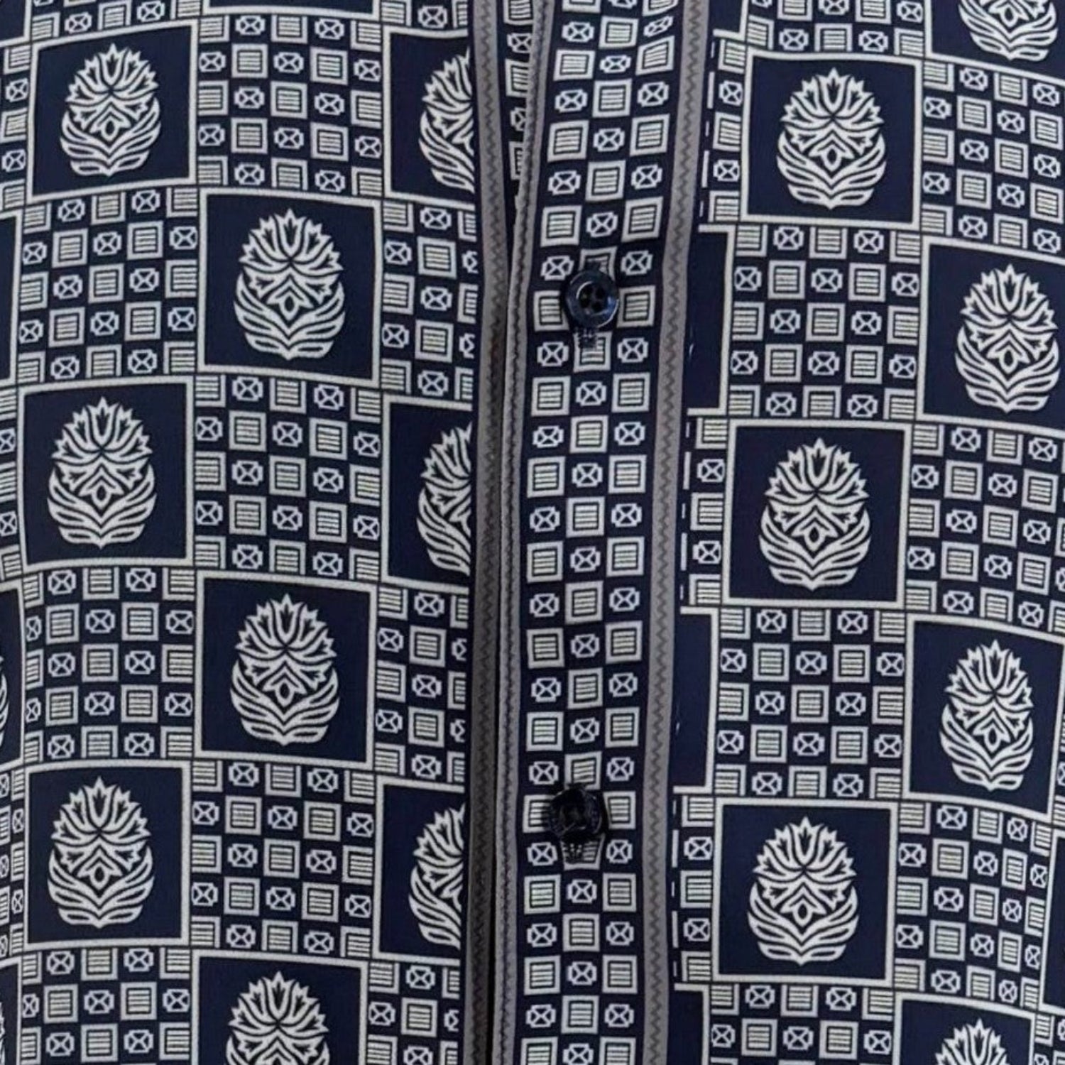 Close-up of navy geometric tile and medallion shirt print