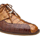 Close-up of genuine caiman leather texture and precision stitching on a walnut Oxford shoe