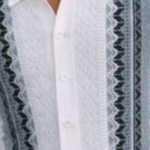 Close-up of black Stacy Adams walking suit shirt showing the intricate vertical knit texture and button details.
