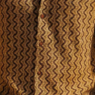 Close-up of brown textured geometric knit fabric on Stacy Adams short sleeve shirt