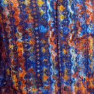 Close-up of the navy shirt showing the abstract print and textured linen blend fabric.