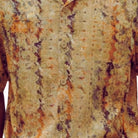 Close-up of the khaki shirt showing the abstract print and textured linen blend fabric.